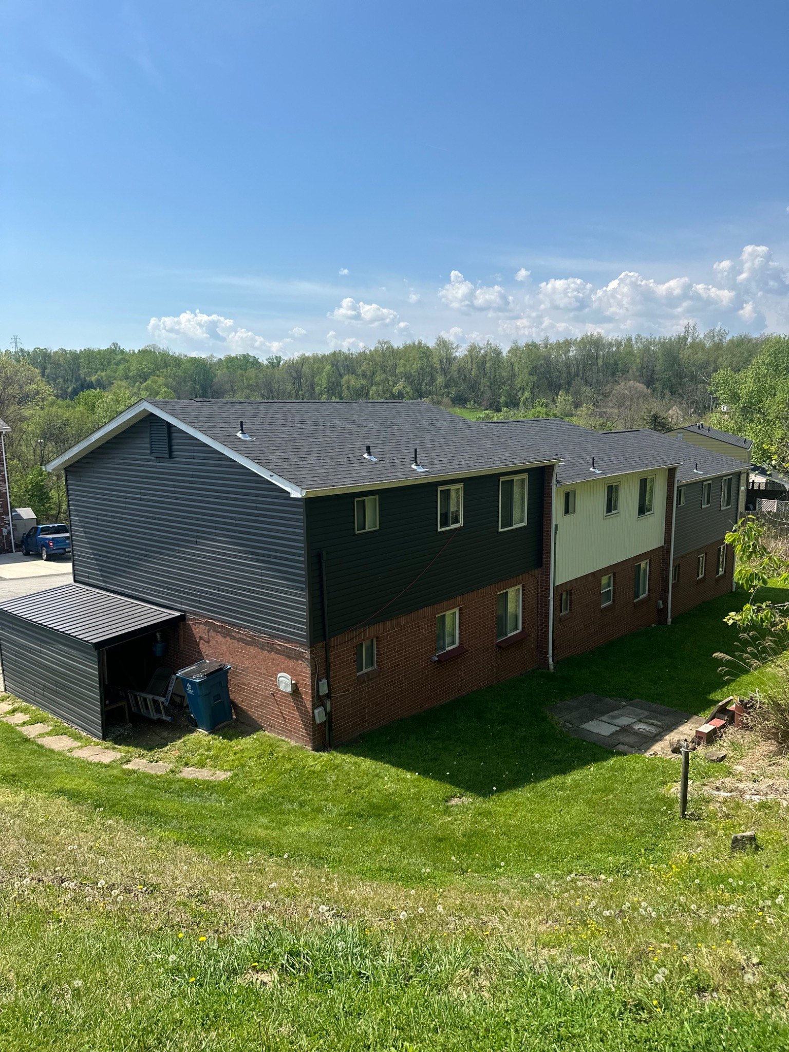 Residential multifamily building with updated siding and roof